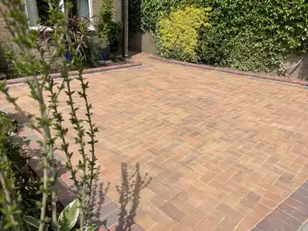 Herringbone block paving driveway with a dark edge course